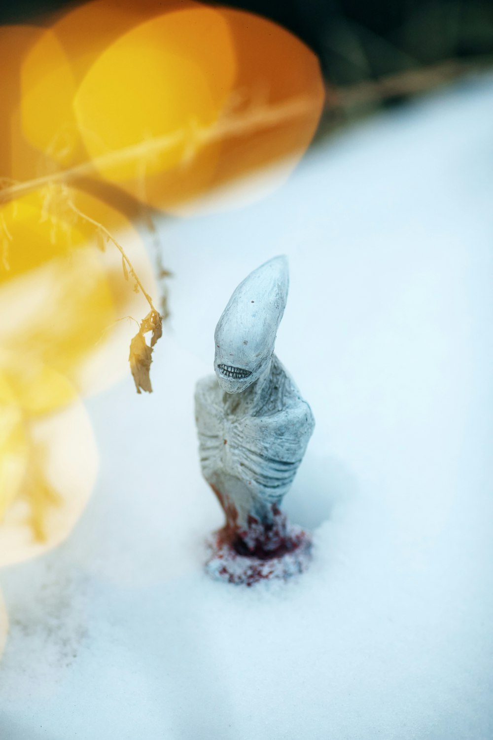 gray and white bird figurine