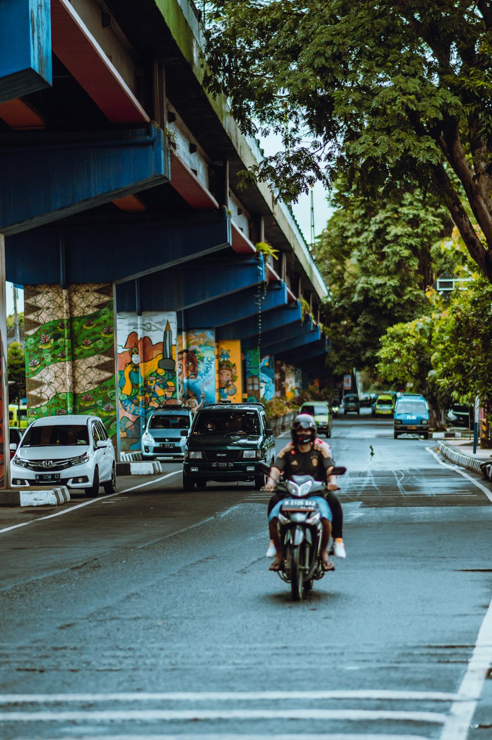 man in black jacket riding motorcycle on road during daytime