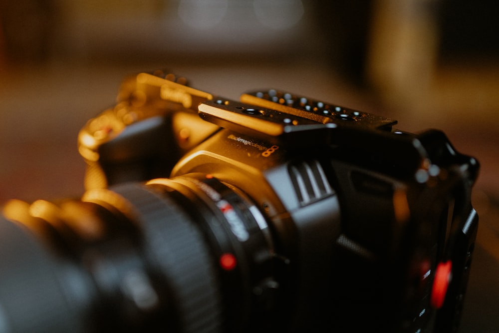 black nikon dslr camera on brown wooden table