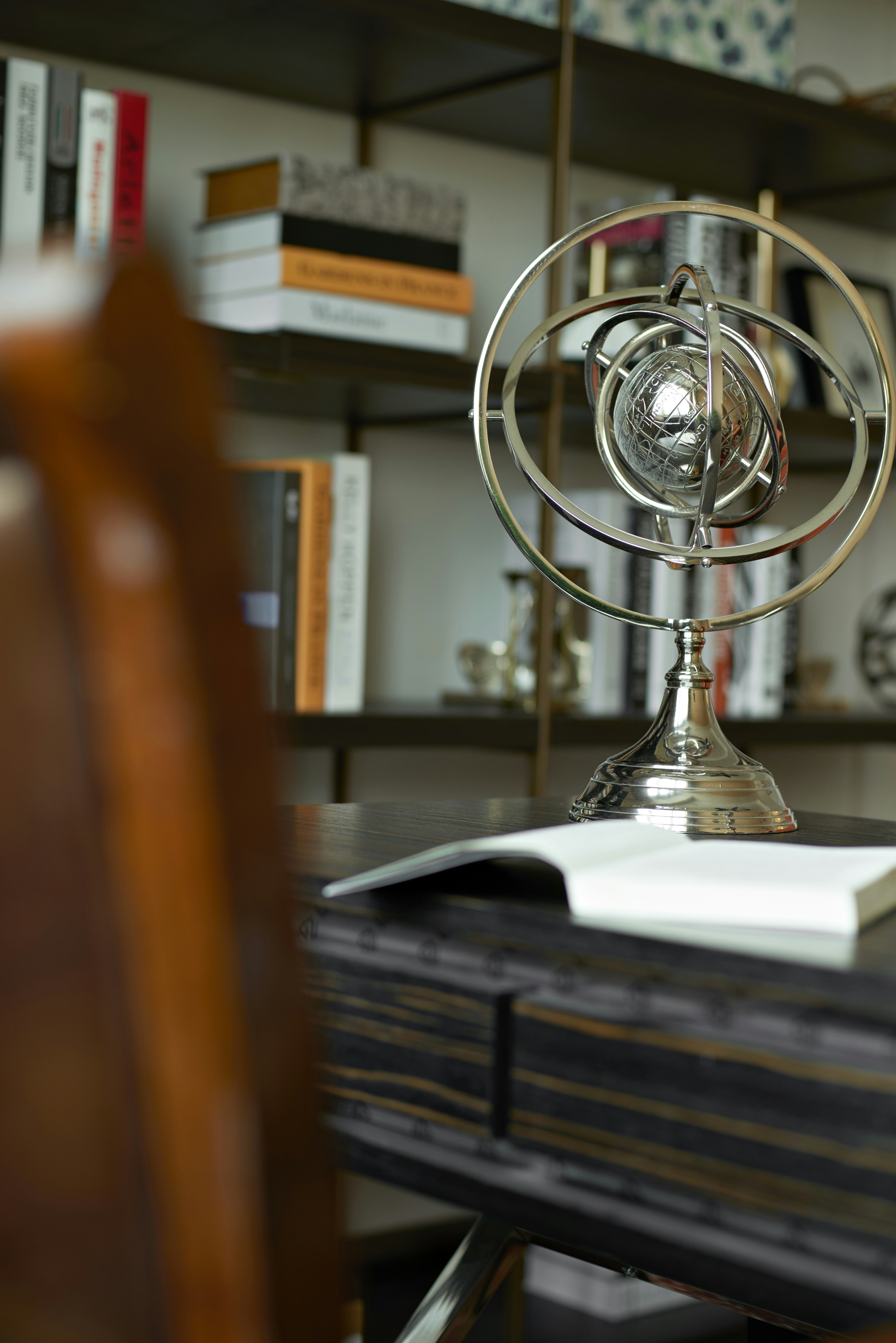 stainless steel desk fan on brown wooden table