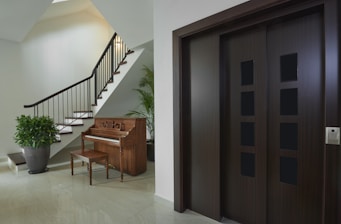 brown wooden bench beside brown wooden door