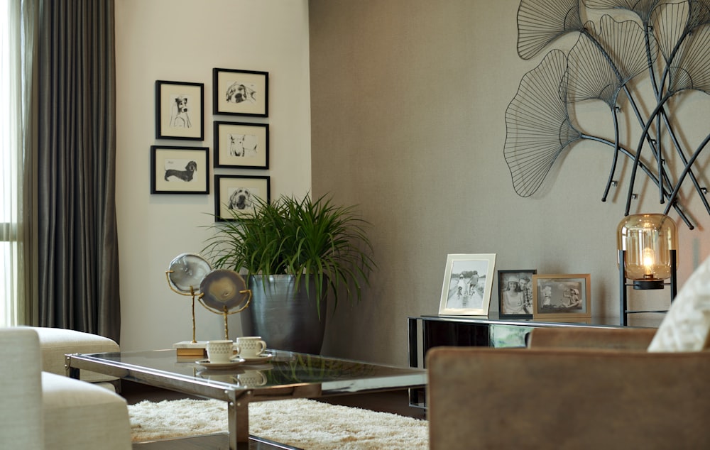 silver stand fan beside brown wooden table