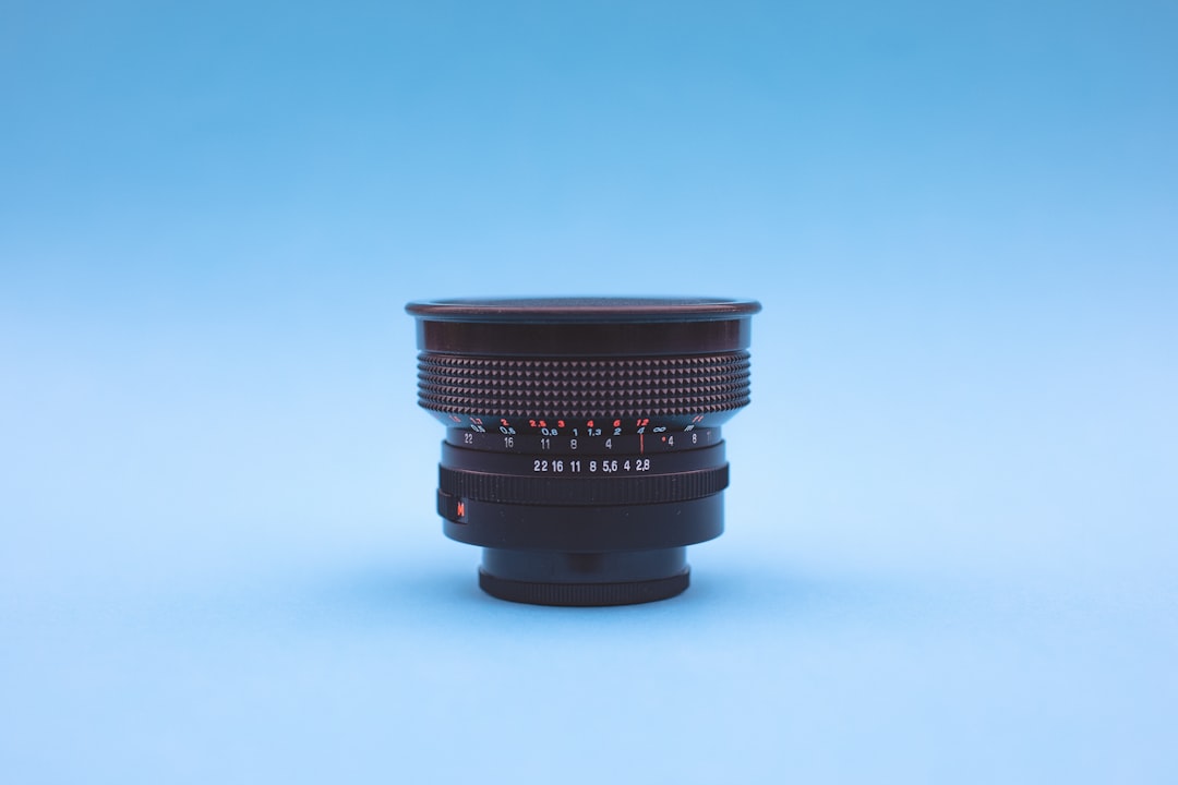 black and gray portable speaker, Vintage analog wide angle lens – Carl Zeiss Jena Flektogon red MC 2.8 20mm (Year: 1976)