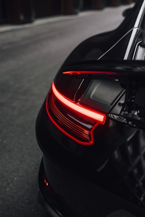 red and black car on road