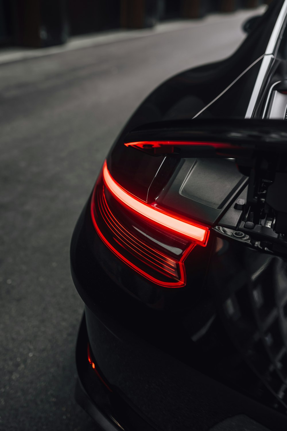 red and black car on road