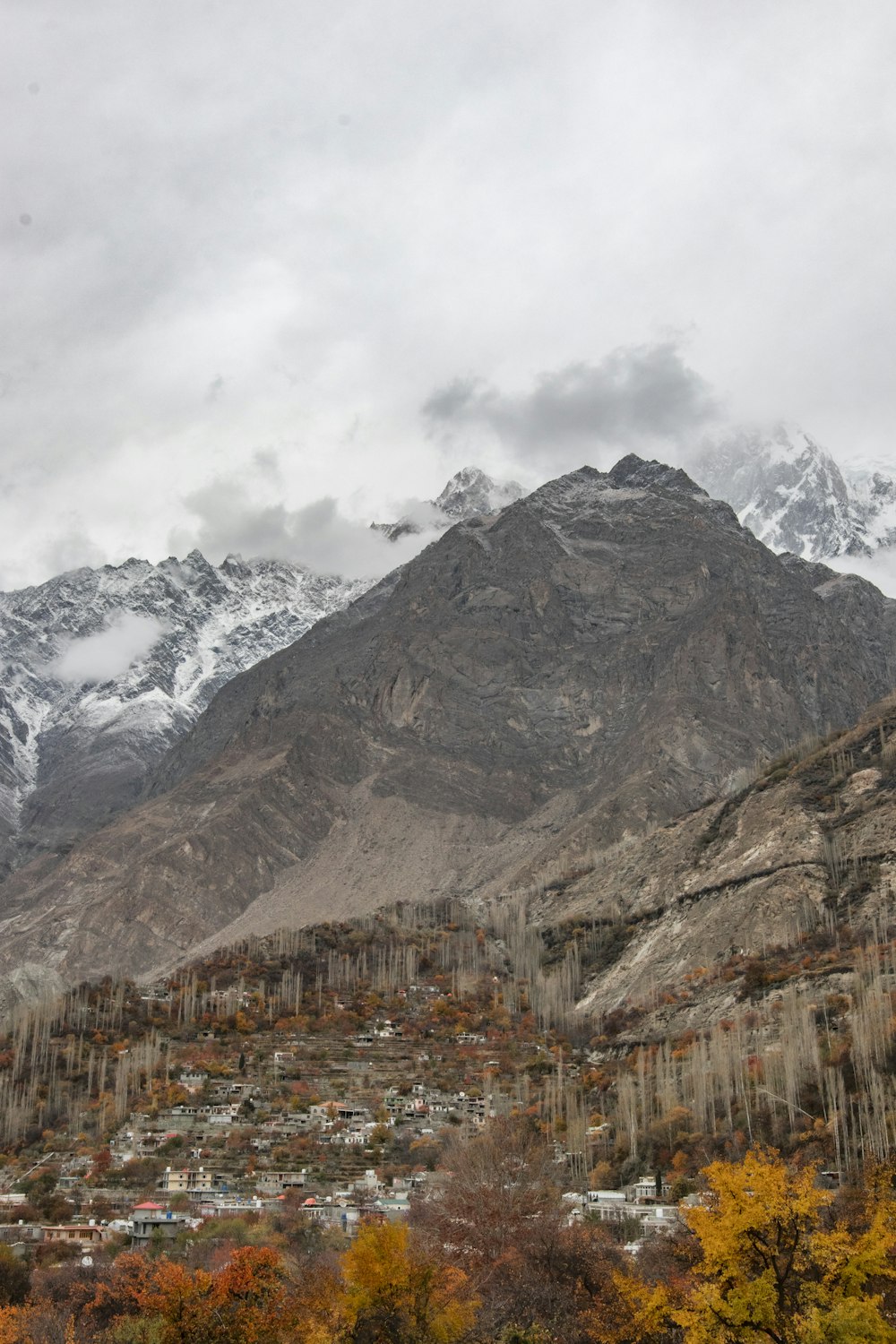 brown and white mountain under white clouds during daytime