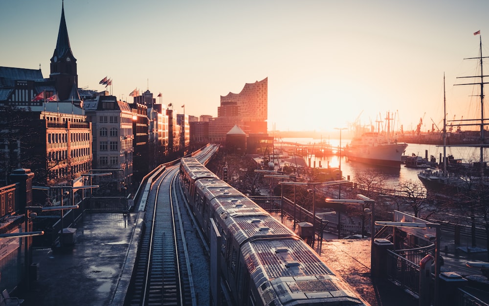 city buildings near the road during sunset