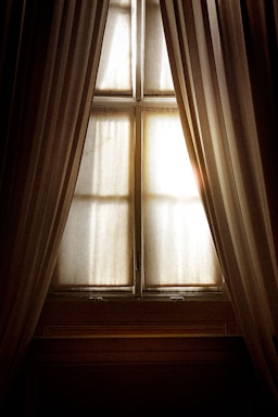 white window curtain on window