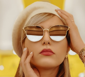 woman wearing gold framed aviator style sunglasses