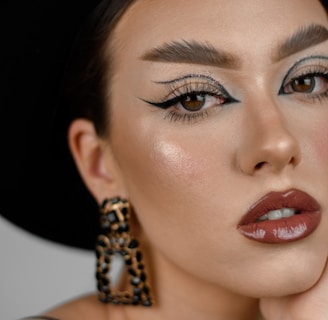 woman wearing black hat and gold necklace