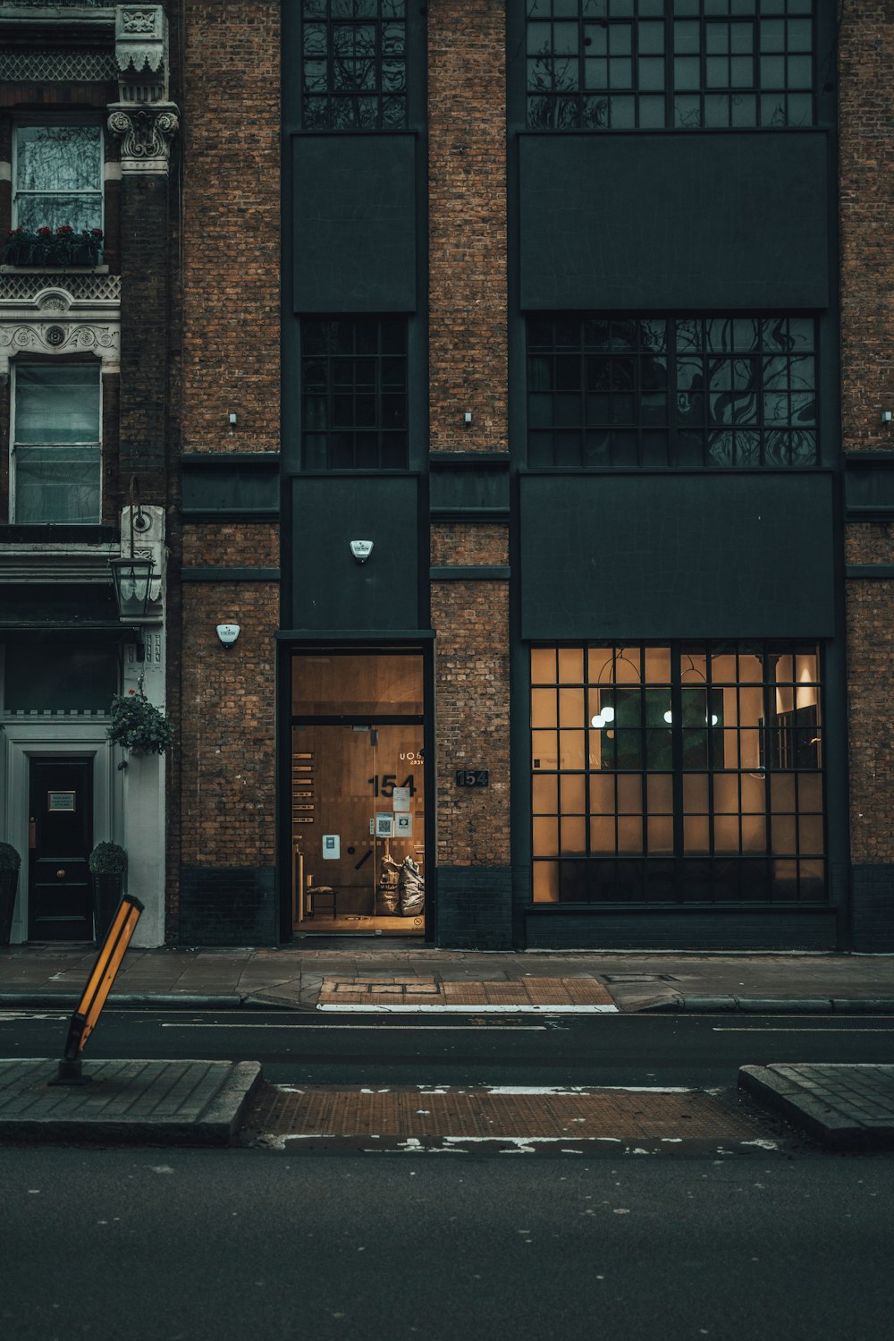 brown brick building with glass window