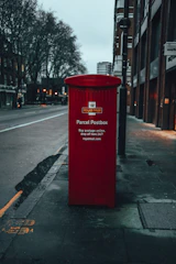 A parcel on a doorstep in a typical British neighborhood.