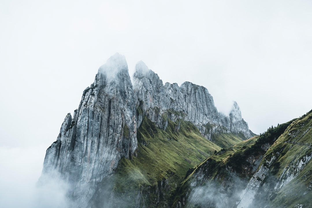 green and gray mountain under white sky during daytime