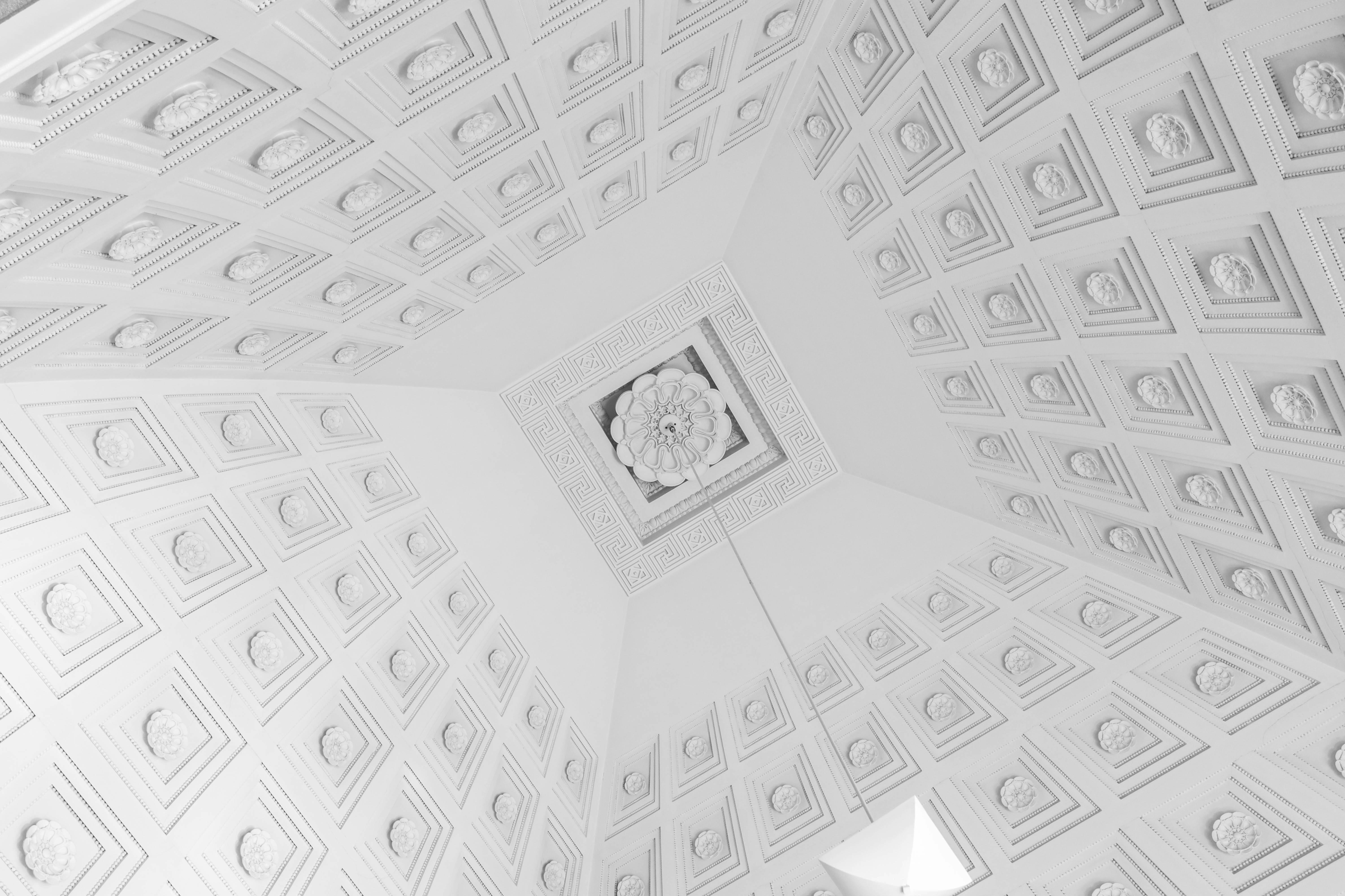 grayscale photo of a man in black suit jacket