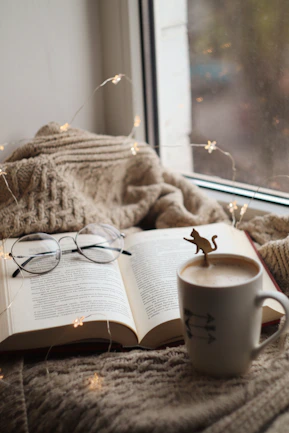 silver framed eyeglasses on book page