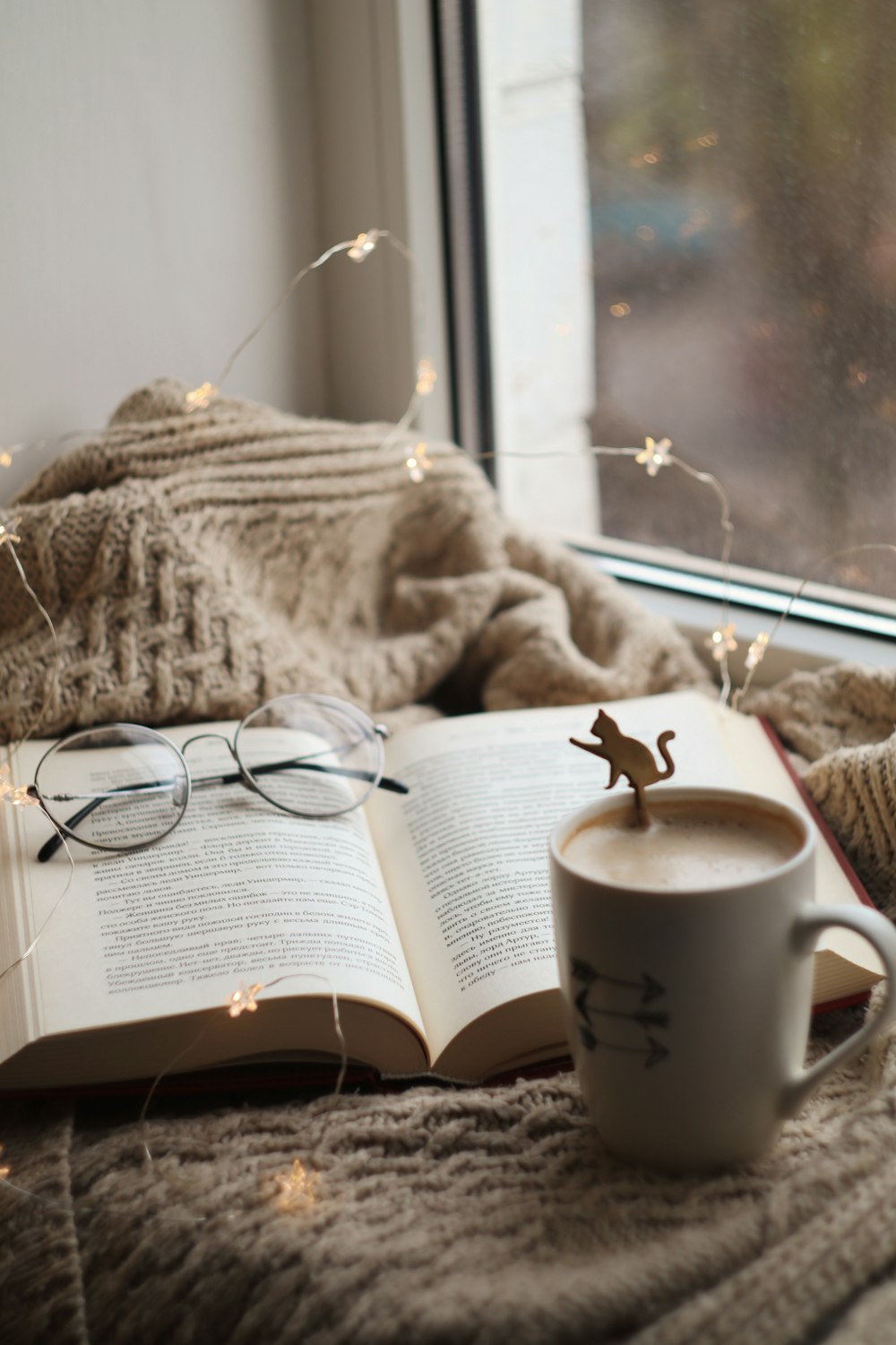 silver framed eyeglasses on book page