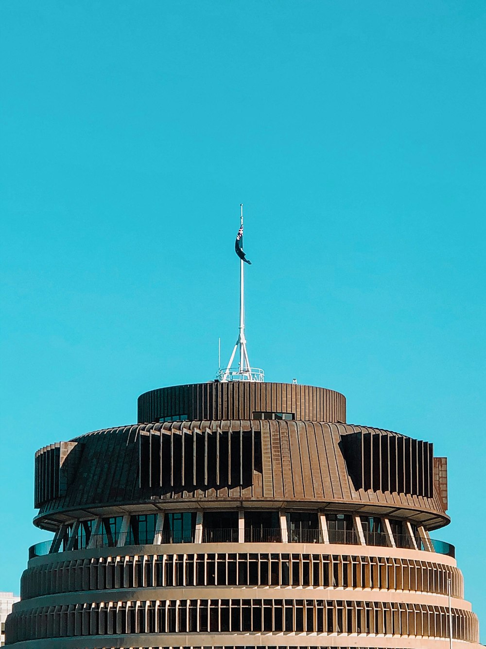 brown concrete building under blue sky during daytime