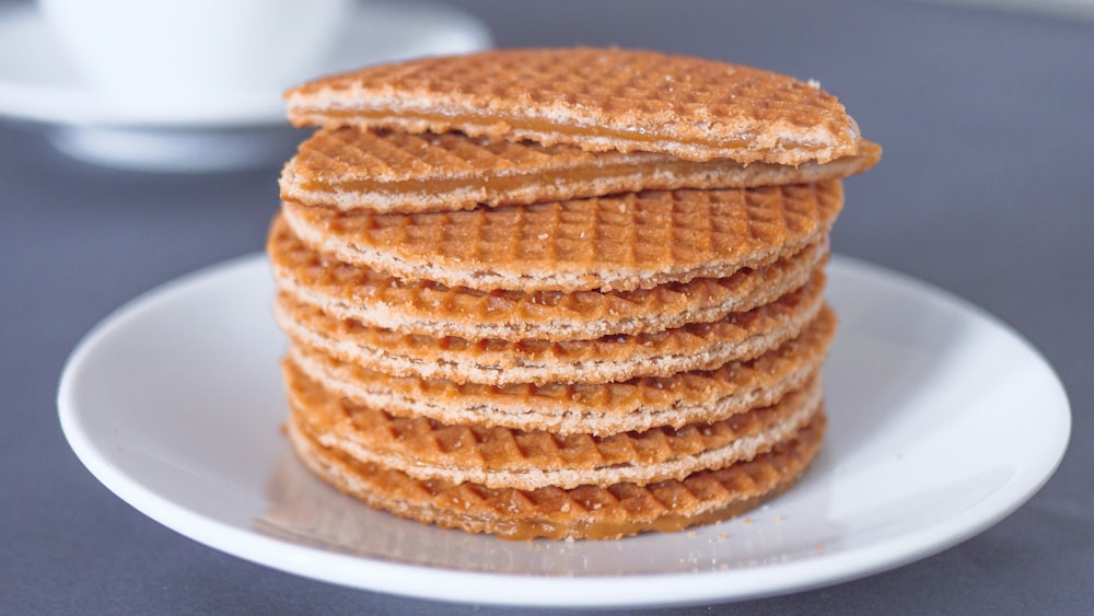 brown and white cake on white ceramic plate