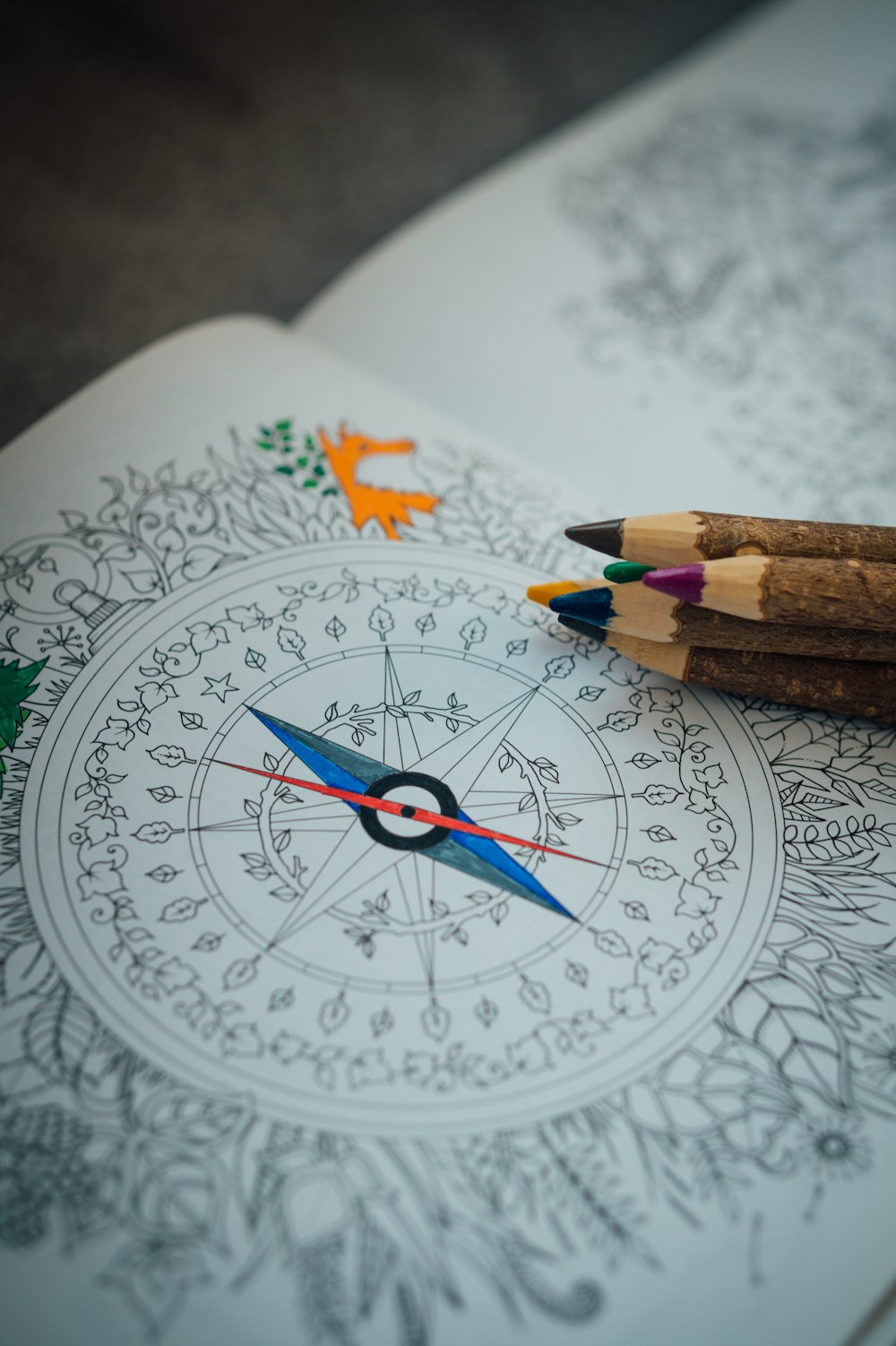 red pencil on white and blue floral round plate