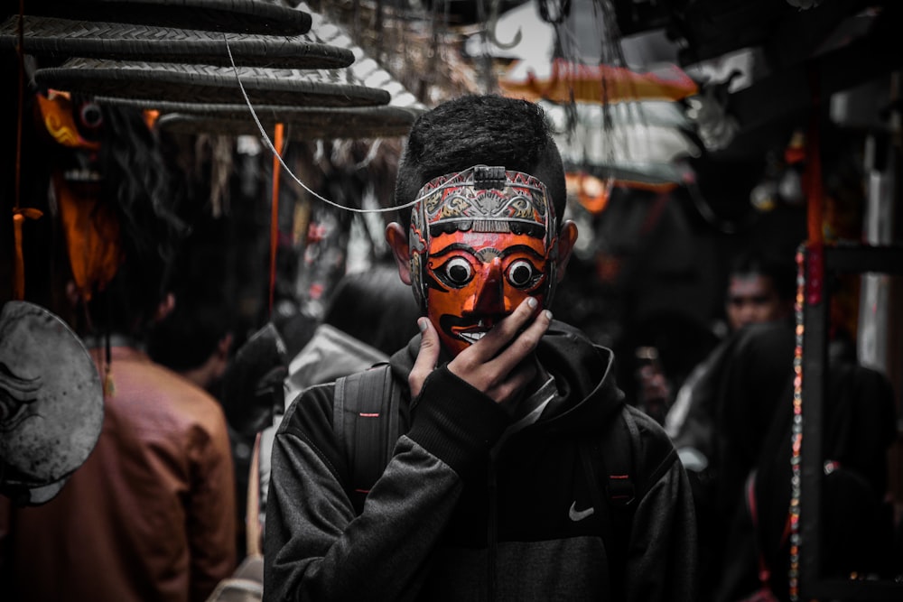 man in black jacket wearing mask