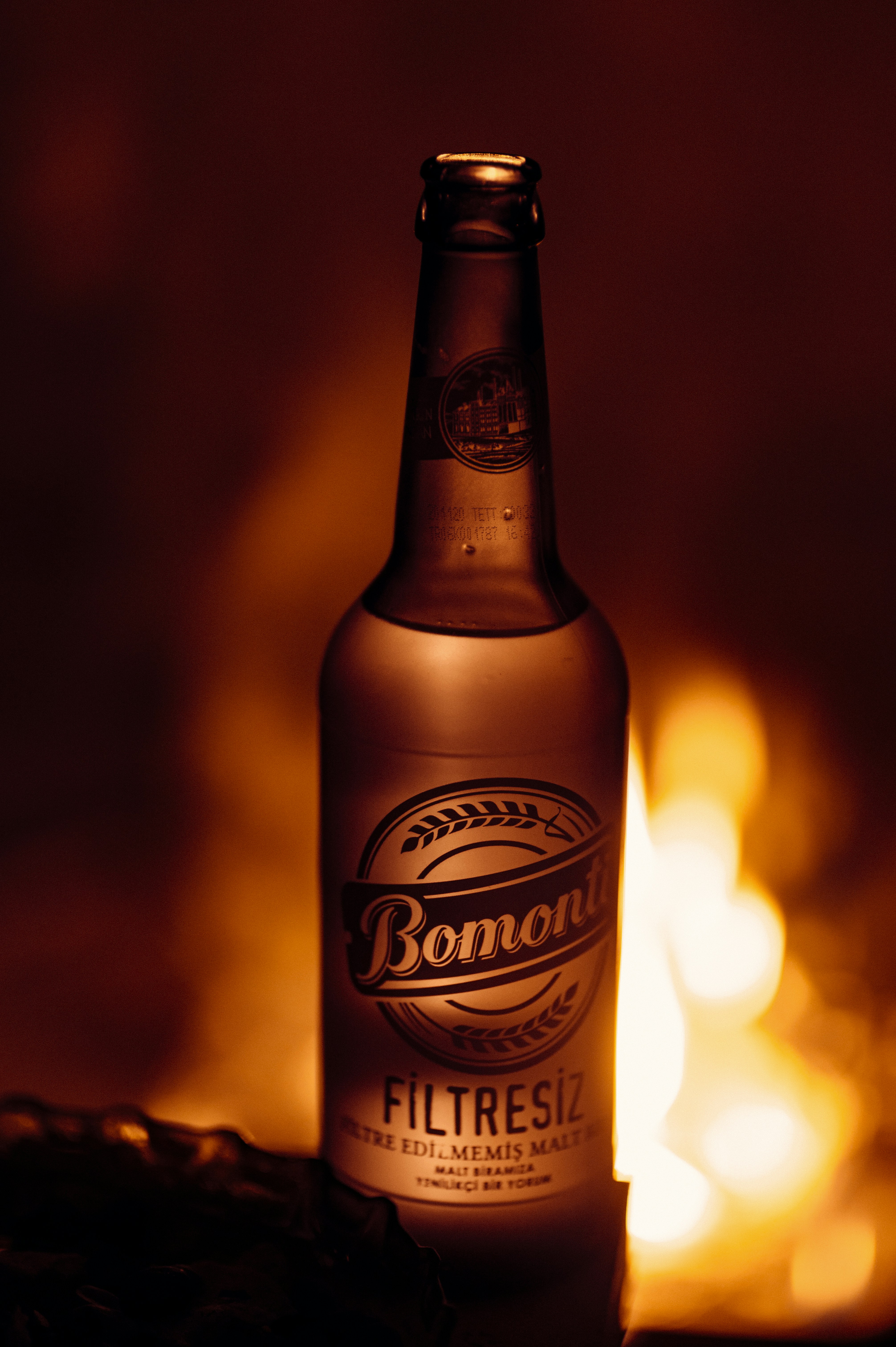 brown and black labeled bottle