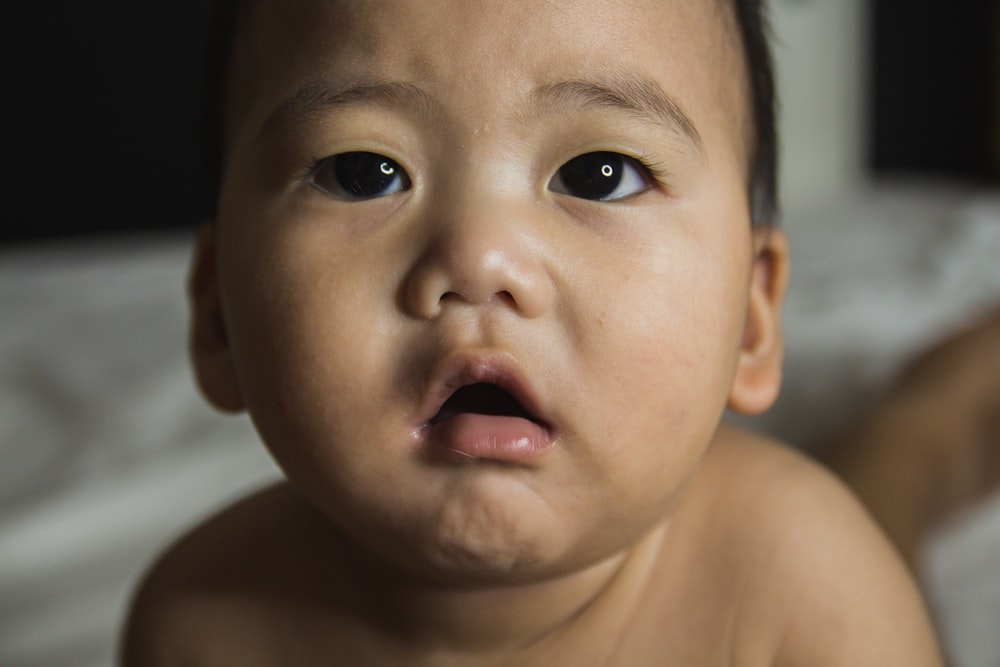 topless baby with blue eyes