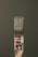 A paintbrush bristling with dark green paint stands vertically against a matching green background. The handle bears signs of wear, with paint splatters and the marking '25MM' visible. The bristles are coated with thick, wet paint.