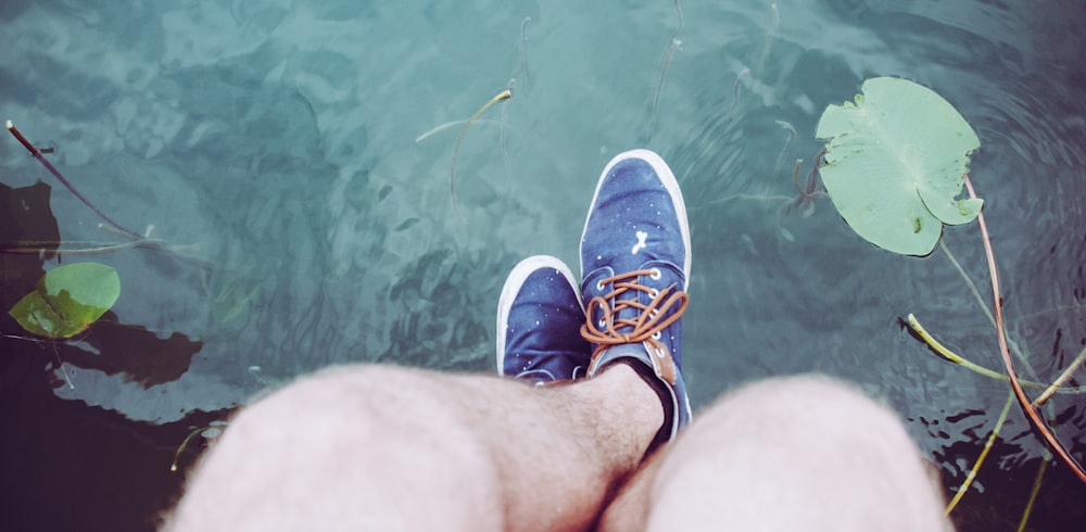 person in blue and white sneakers