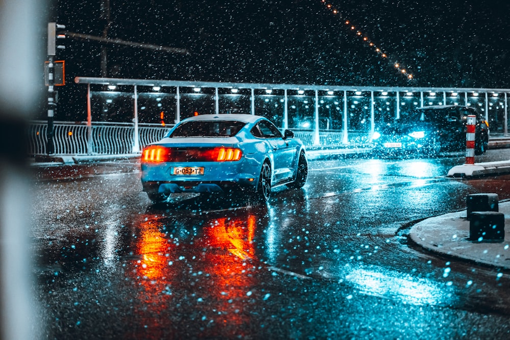 black sedan on road during night time