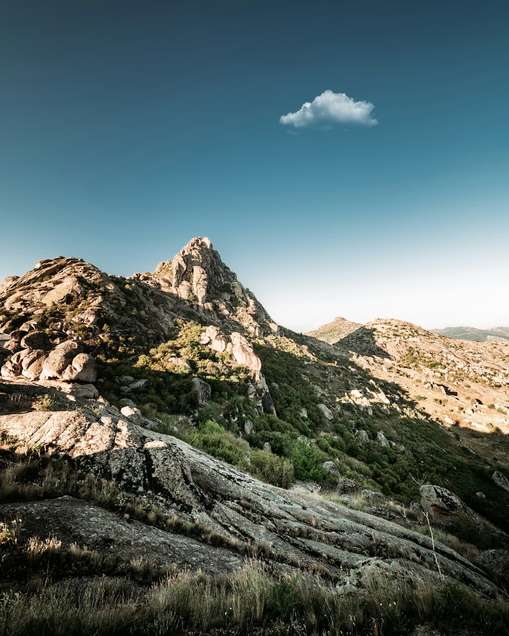 brown rocky mountain under blue sky during daytime