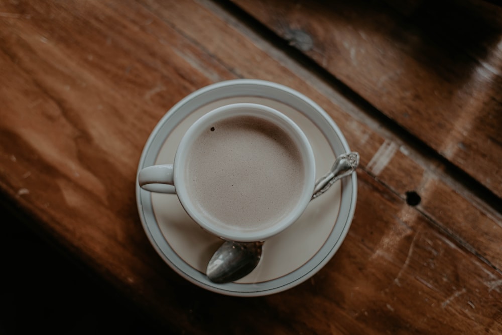 white ceramic mug on white ceramic saucer