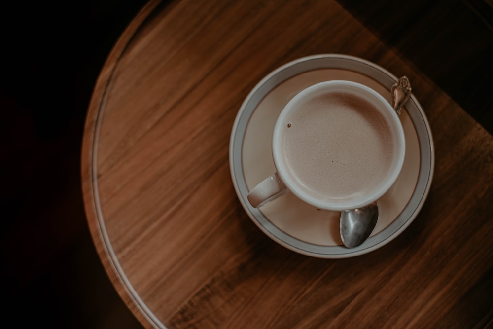 white ceramic mug on saucer