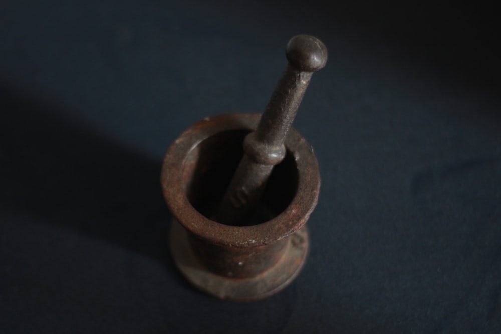 brown wooden mortar and pestle