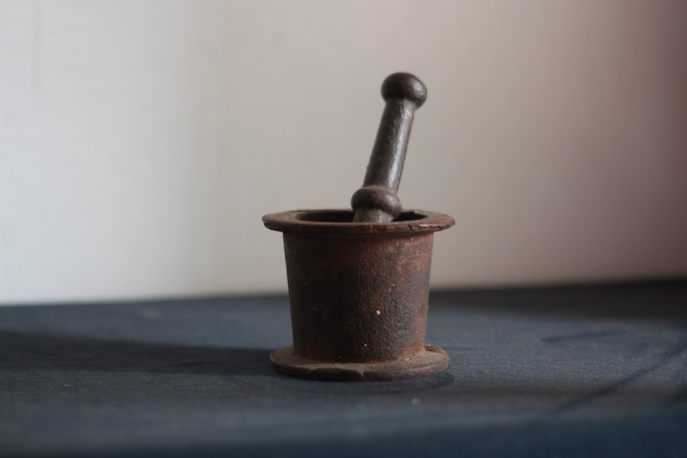 black and brown mortar and pestle