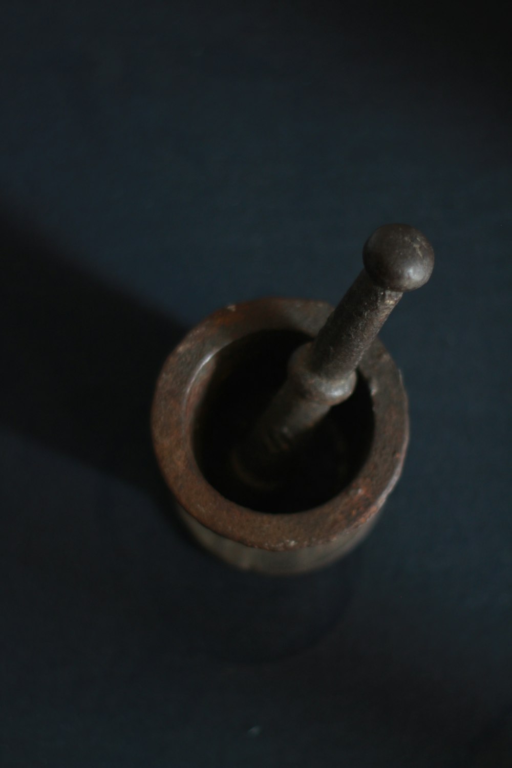 brown wooden mortar and pestle