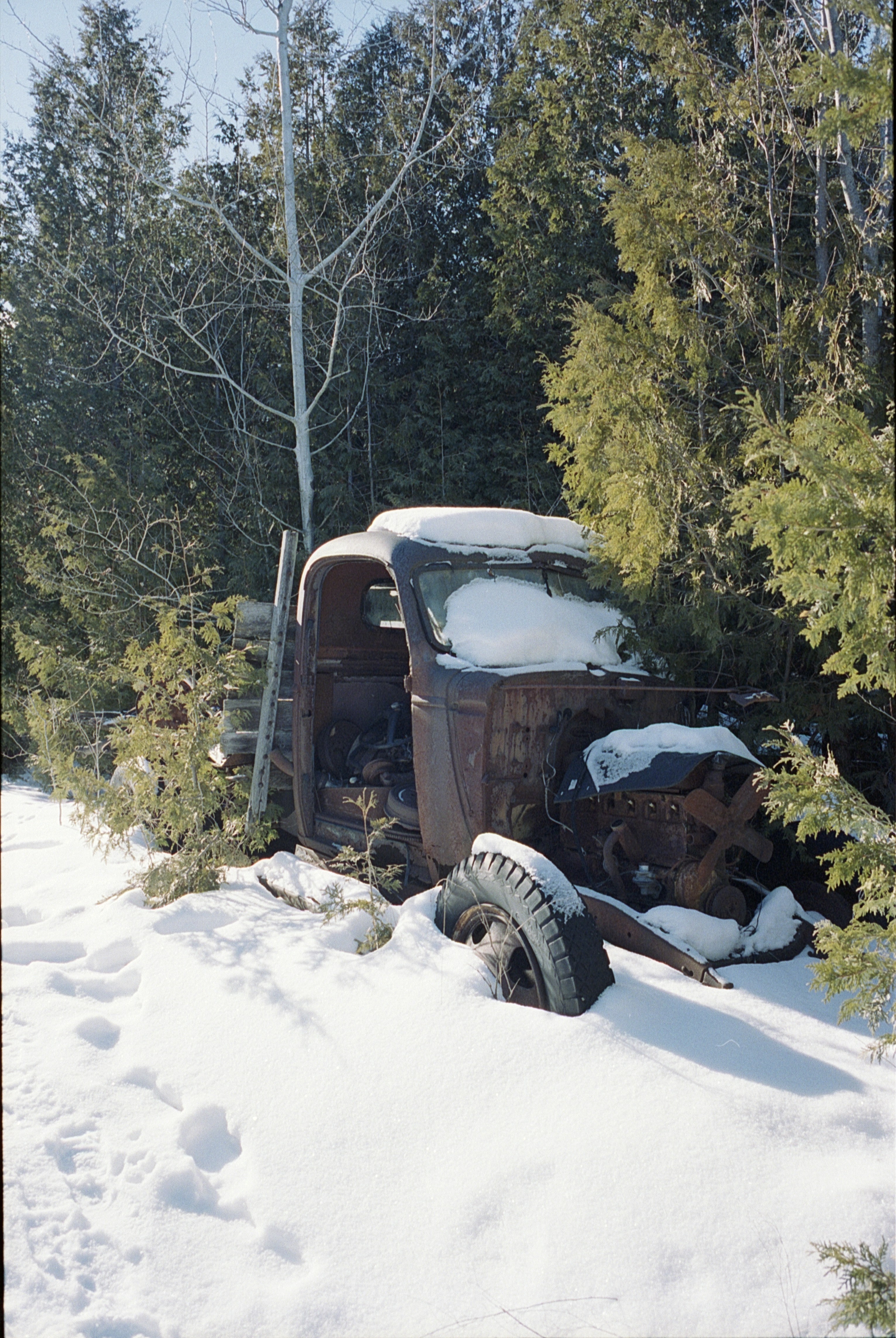 black suv on snow covered road during daytime