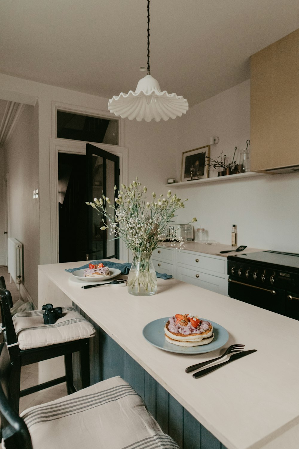 white ceramic plate on white table