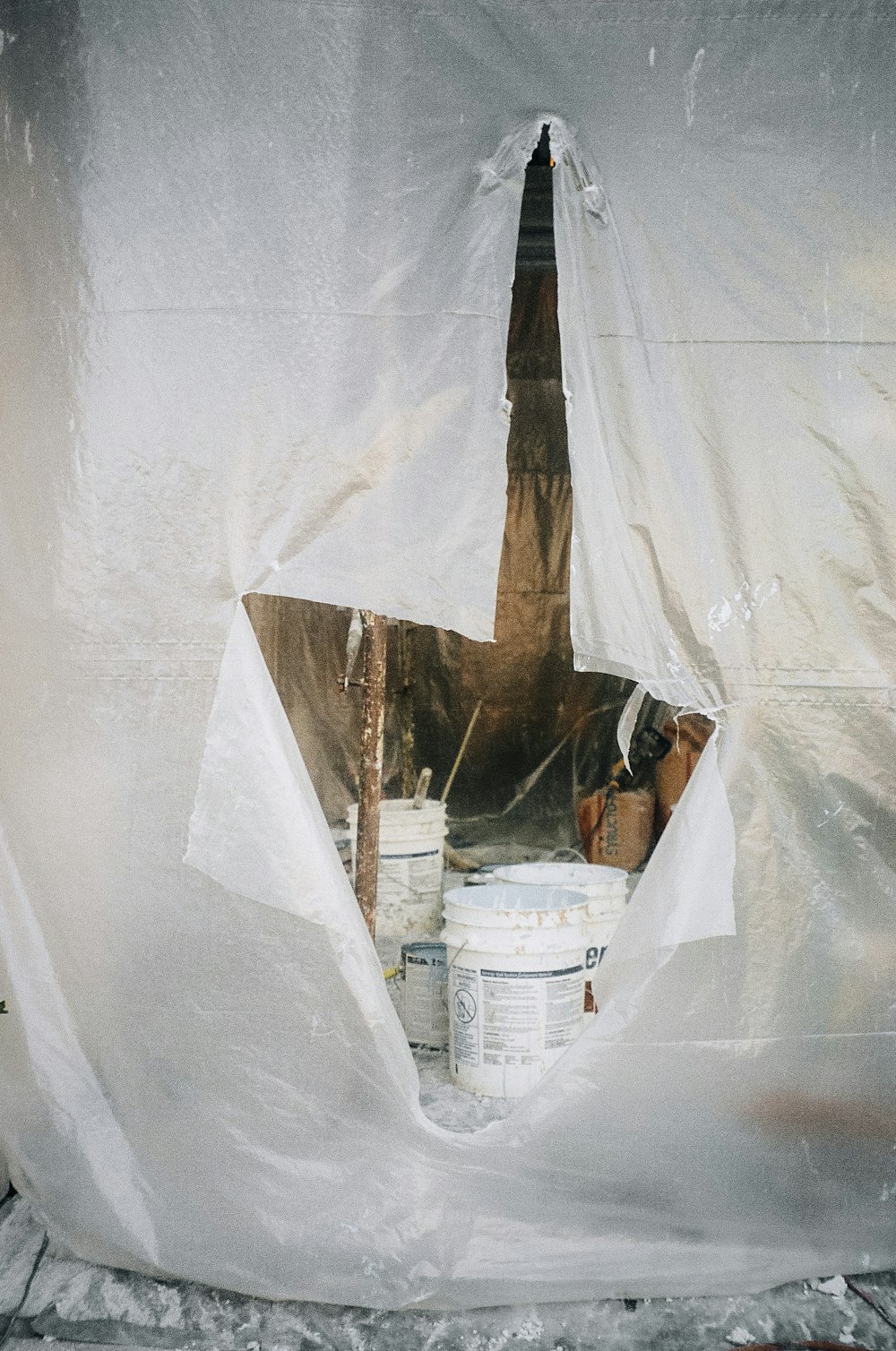 white plastic bucket beside white plastic bucket