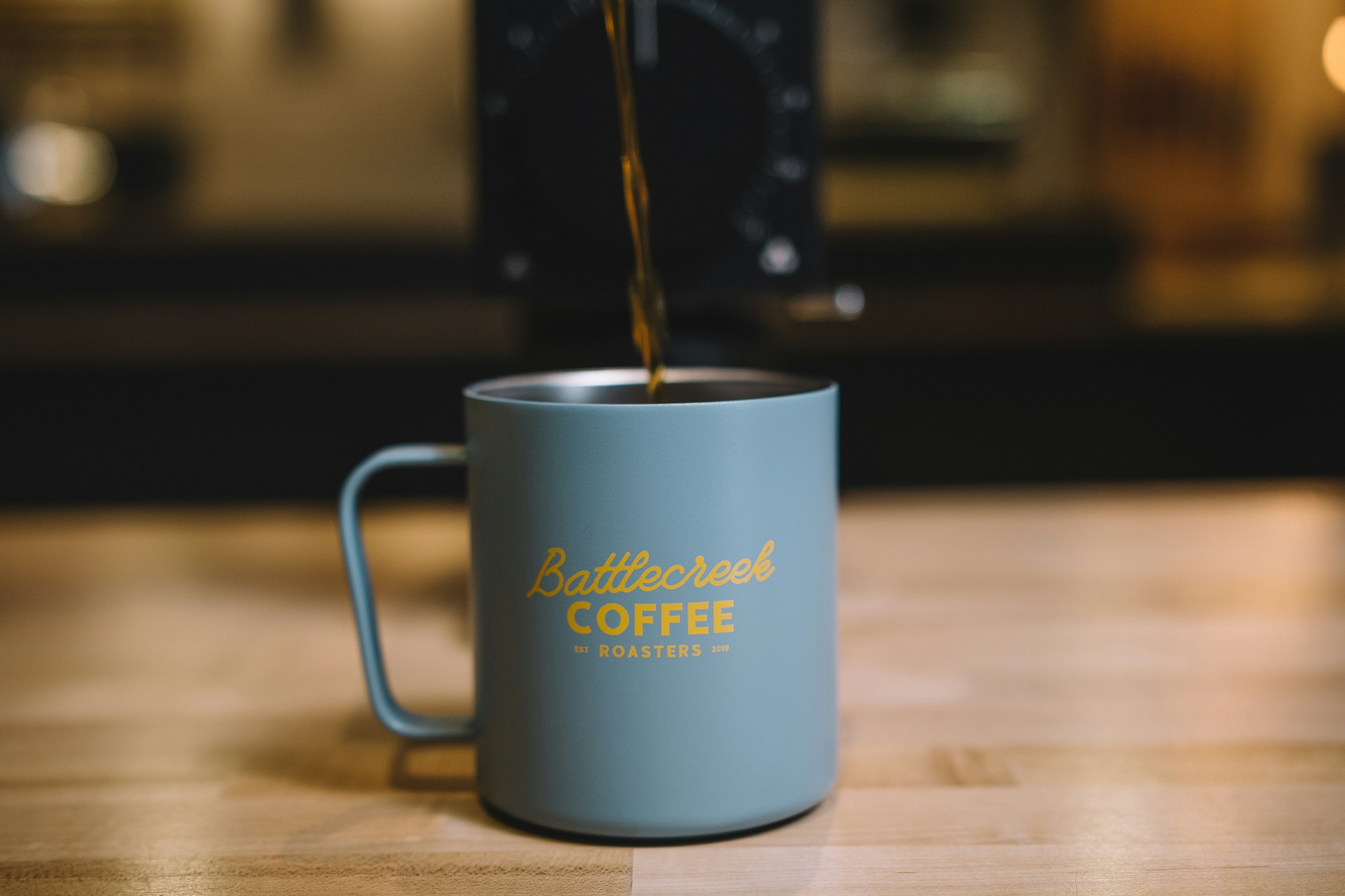 blue ceramic mug with coffee