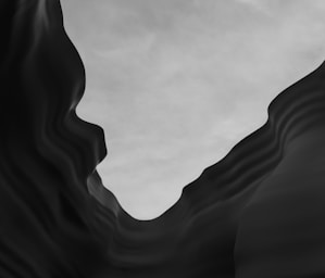 grayscale photo of a cave