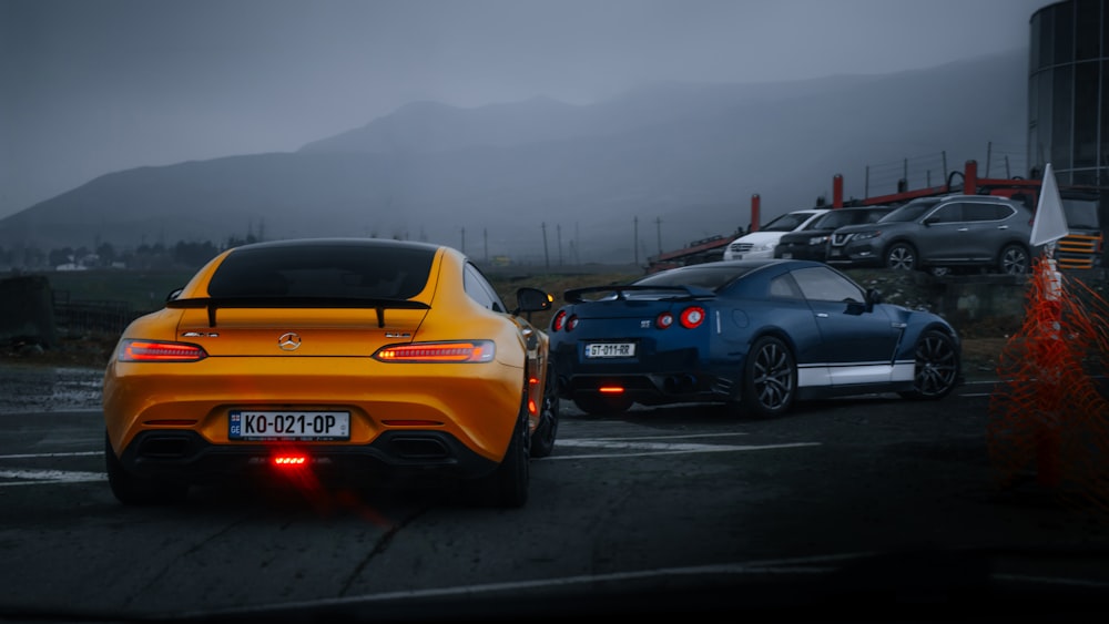 yellow and black porsche 911 on road during daytime