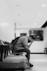 man in black jacket sitting on chair
