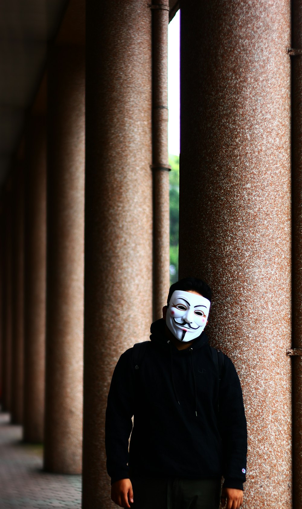 person in black and white mask