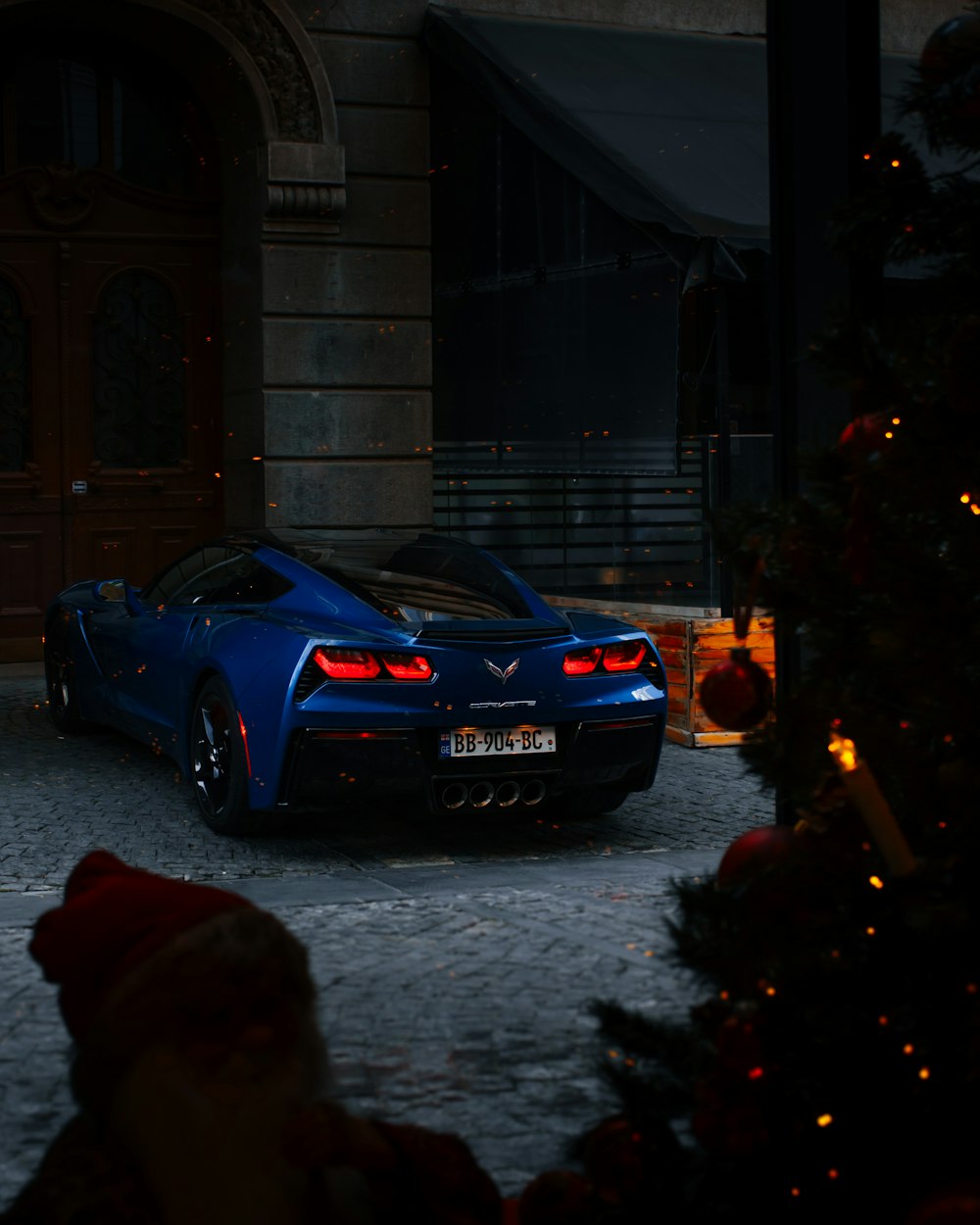 blue bmw m 3 parked on street during nighttime