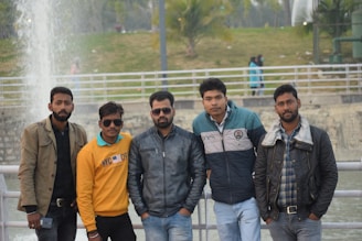 Casual outdoor scene with men in jeans.