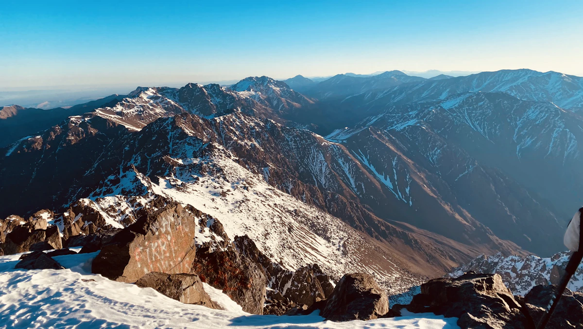 Snow-capped Mount Toubkal under a blue sky, High Atlas, Morocco