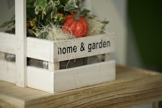 red strawberries on brown wooden crate