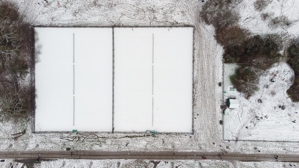 white wooden door on gray concrete wall