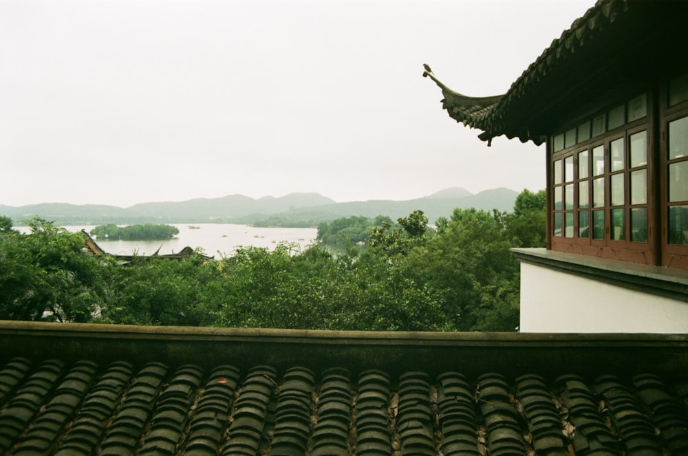 brown roof near green trees during daytime