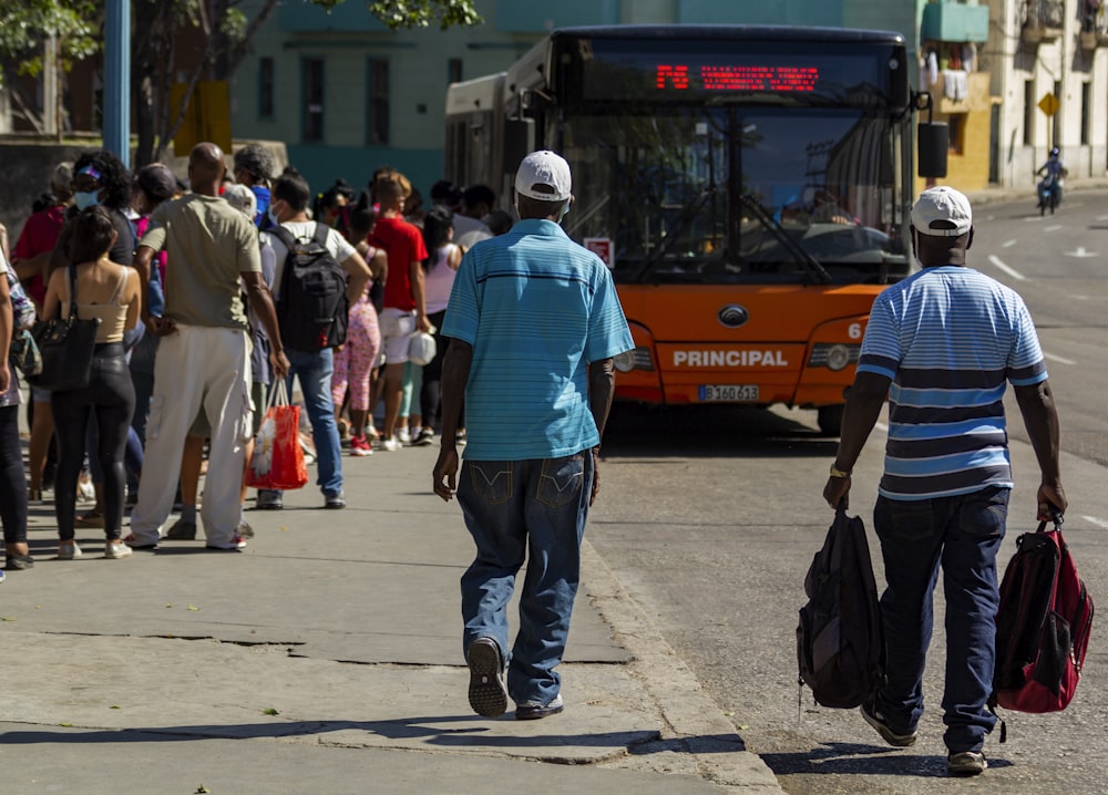 people walking on sidewalk during daytime